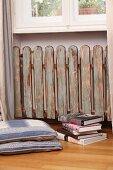 Radiator cover made of picket fence