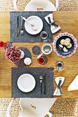 Wooden table set with hand-made, grey felt place mats and coasters