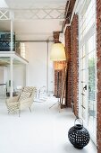 Classic, designer loft apartment with gallery, steel girder structure and floor-to-ceiling windows in brick facade