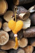 Yellow, hand-knitted yarn heart