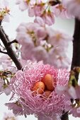 Nest of sugar eggs in flowering cherry tree
