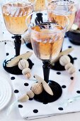 Wine glasses with threaded wooden beads tied around stems