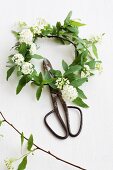 Wreath of spirea and vintage garden scissors