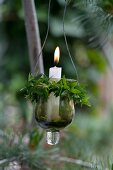 Suspended candle lantern wrapped in sprigs of myrtle