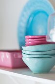 Stacked pink and light blue ceramic bowls
