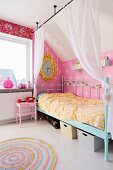 Canopy bed with turquoise, retro metal frame and curtains draped from rods hung from ceiling in nostalgic child's bedroom