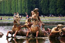 Metal horse figures in the Apollo Fountain in the Garden of the Palace of Versailles