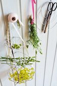 Herb flowers in tiered hanging basket hand-crafted from aluminium wire