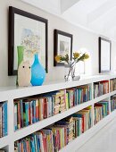 Vases on low bookcase in knee wall
