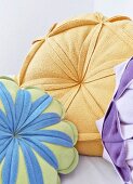Flower-shaped scatter cushions in various colours