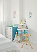 Heirloom chest of drawers and table refreshed with pastel paint combined with lamp and stool by young designer