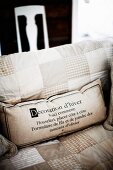 Scatter cushion with printed lettering on seat cushion