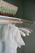 Close-up of child's clothing hanging in wardrobe