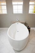 White free-standing bathtub in contemporary bathroom