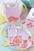 Colourful paper gift tags stamped with Easter and spring motifs