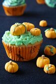 Halloween cupcakes decorated with marzipan pumpkins