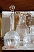 Antique glass carafes on tray