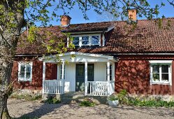 Swedish wooden house with white porch
