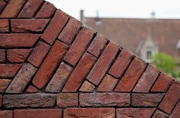 Detail of angled, brick garden wall