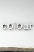 Decorative letters spelling 'colour' on wall