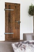 Rustic interior door with wrought iron fittings and latch
