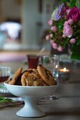 Chocolate-chip cookies in white china dish on set table