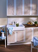 Kitchen cabinet doors refurbished with wood-effect panels