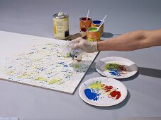 Instructions for making colourful kitchen splashback with splashes of paint