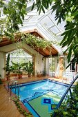 Indoor pool with colourful tiled bottom and glass roof
