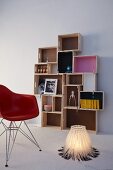 DIY shelving made from wooden crates of various sizes and lamp made from cable ties