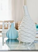 White and pale blue vases with structured surfaces
