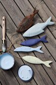 Hand-painted, carved wooden fish as maritime decorations