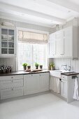 White, Scandinavian country-house kitchen with vintage ambiance
