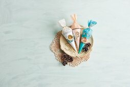 Vintage-style paper cones of sweets with cherub motifs