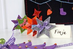 Hand-crafted festive place cards decorated with felt stars & ribbons