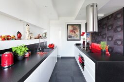 Designer kitchen in black and white with Oriental accessories