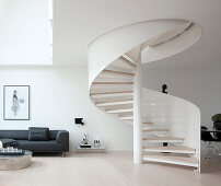 White spiral staircase in modern monochrome interior