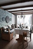 Rustic dining area with bench against stone wall