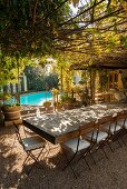 Rustic wooden table and swimming pool on restaurant terrace