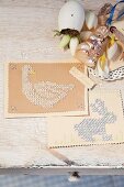 Cards embroidered with Easter motifs on vintage surface