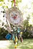 Wind chime hand crafted from old plate and glass beads