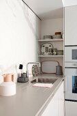 Scandinavian designer pieces in simple kitchen