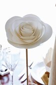 Elegant, white paper rose as festive table decoration