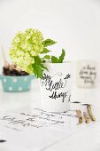Hydrangea in vase with black lettering