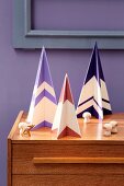 Stylised Christmas trees made from painted plywood