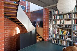 Staircase in industrial loft apartment with brick walls