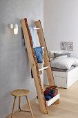 DIY, wooden ladder-style clothes rack in bedroom