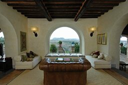 Arches and panoramic windows in Mediterranean living room