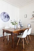 Baroque dining table and modern shell chairs
