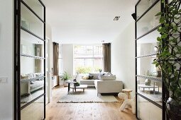 View into modern living room through glass doors